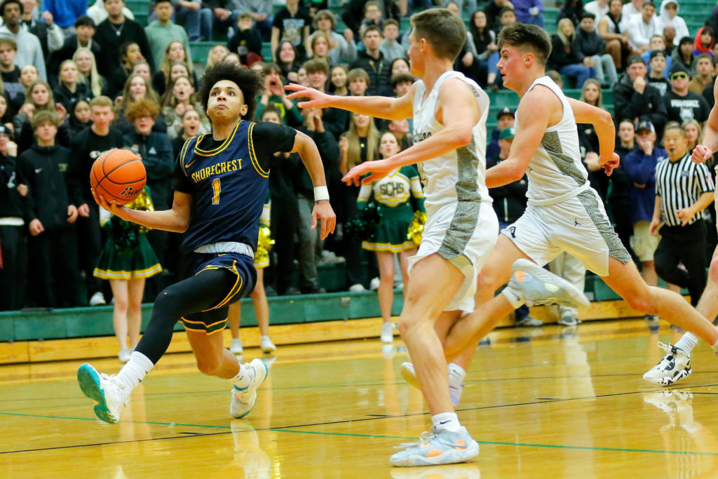 Shorecrest’s Keaine Silimon beats the defense for a fast break layup against Arlington on Wednesday, Feb. 15, 2023, at Jackson High School in Mill Creek, Washington. (Ryan Berry / The Herald)
