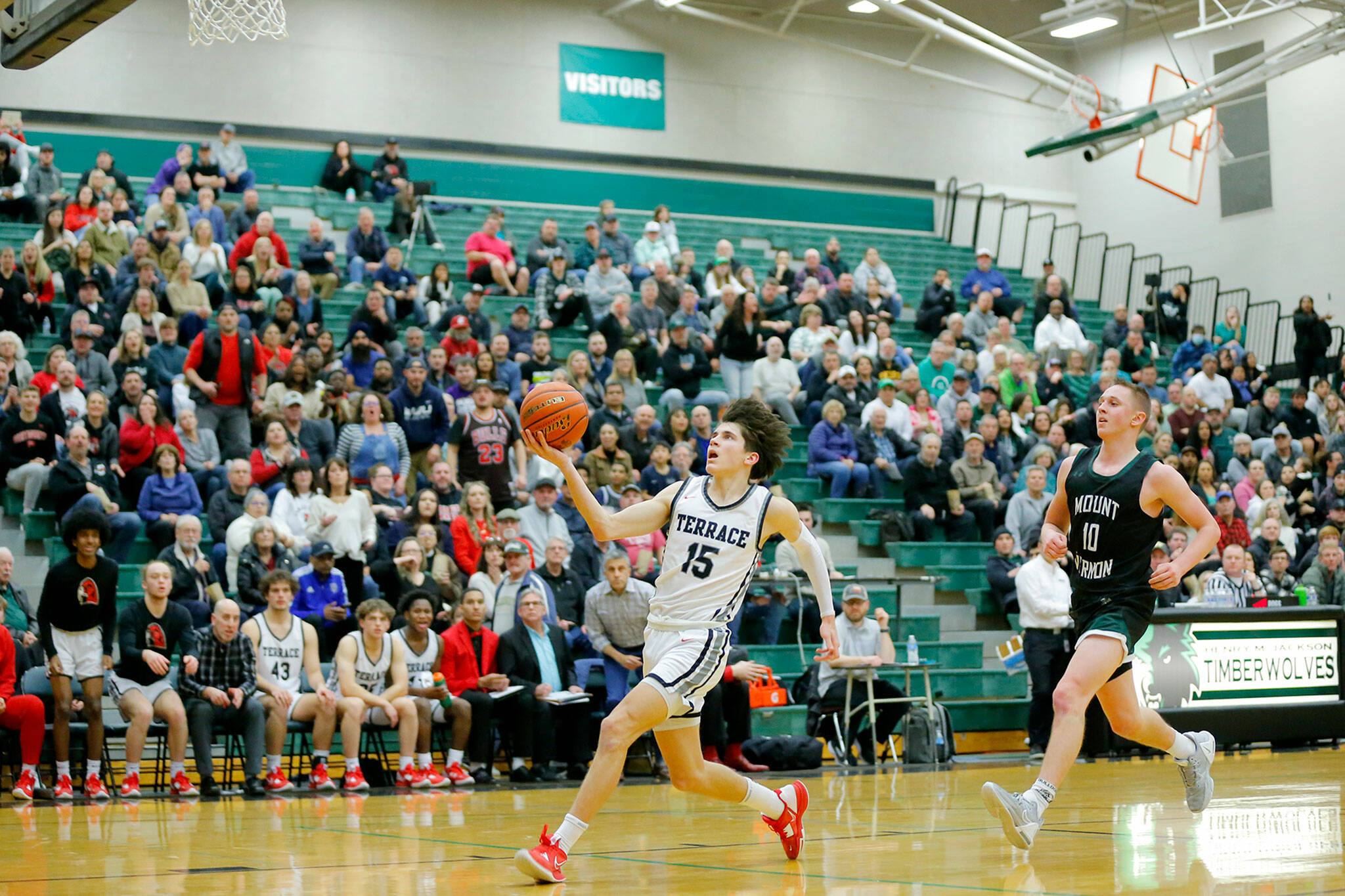 Mountlake Terrace’s Jaxon Dubiel takes a fast break to the house against Mount Vernon on Wednesday, Feb. 15, 2023, at Jackson High School in Mill Creek, Washington. (Ryan Berry / The Herald)