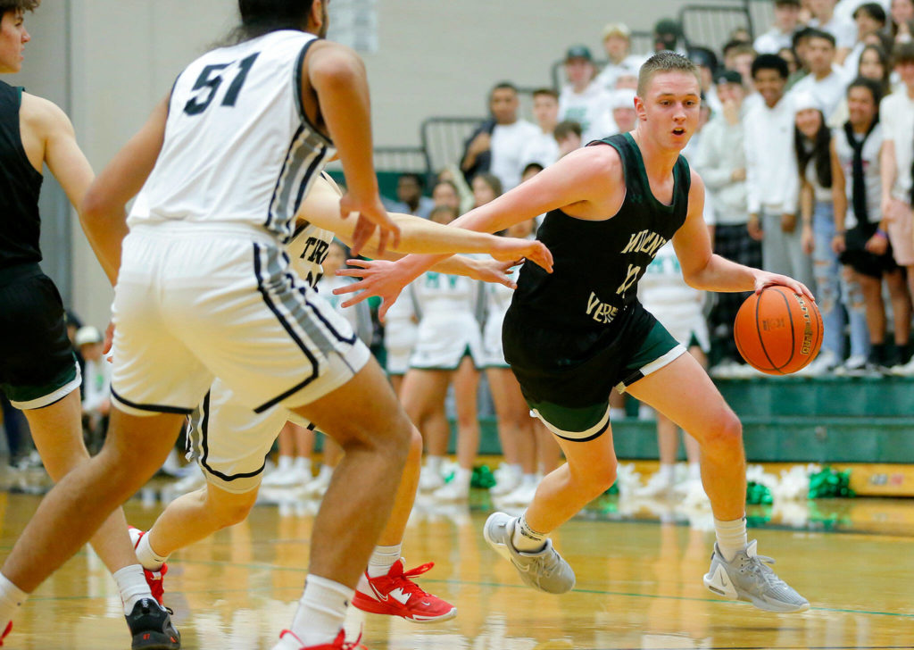 Mount Vernon’s Quinn Swanson tries to take it to the paint against Mountlake Terrace on Wednesday, Feb. 15, 2023, at Jackson High School in Mill Creek, Washington. (Ryan Berry / The Herald)
