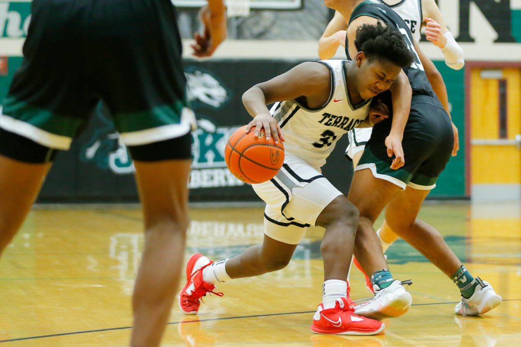 Mountlake Terrace’s Rayshaun Connor runs into a defender while trying to find some space against Mount Vernon on Wednesday, Feb. 15, 2023, at Jackson High School in Mill Creek, Washington. (Ryan Berry / The Herald)
