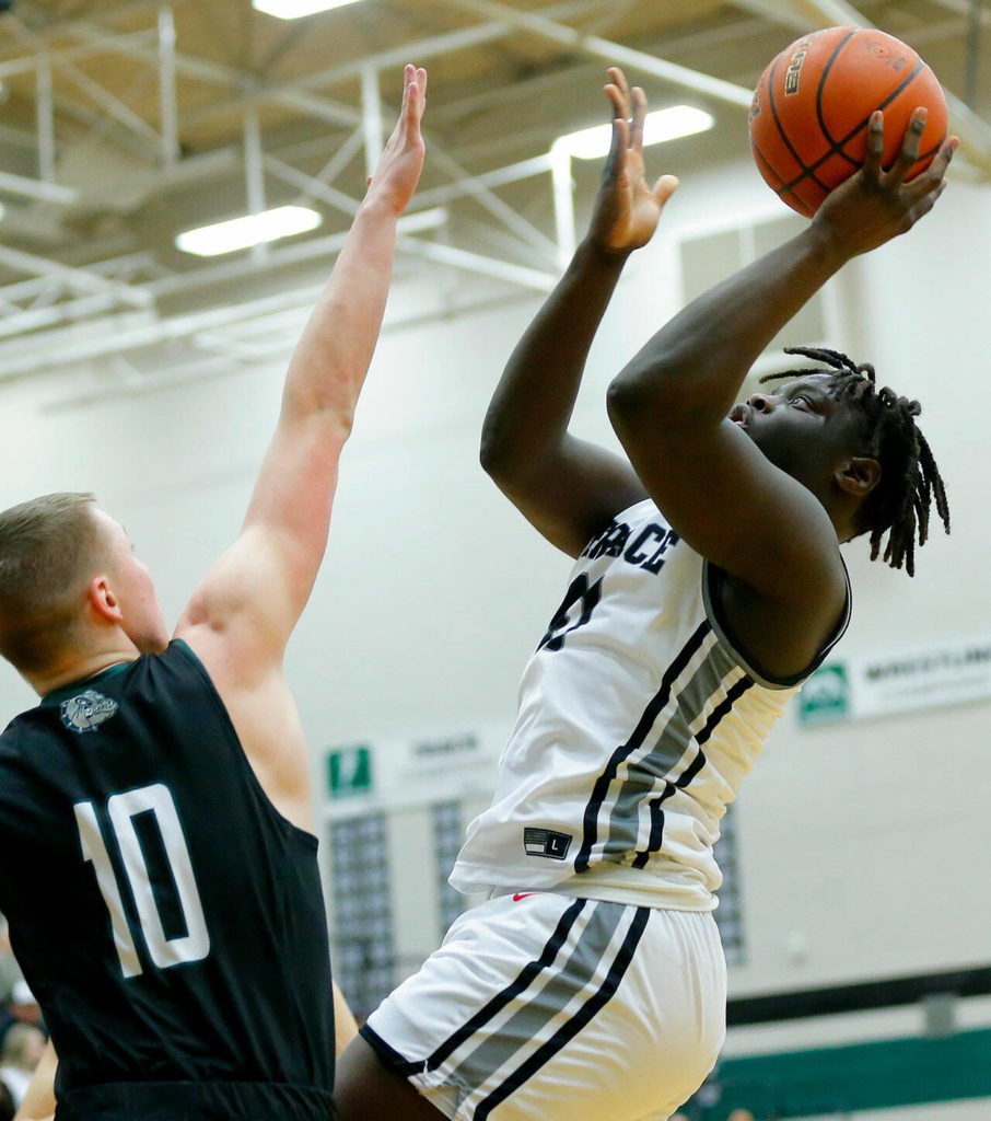 Mountlake Terrace’s Zaveon Jones tries for the putback shot against Mount Vernon on Wednesday, Feb. 15, 2023, at Jackson High School in Mill Creek, Washington. (Ryan Berry / The Herald)
