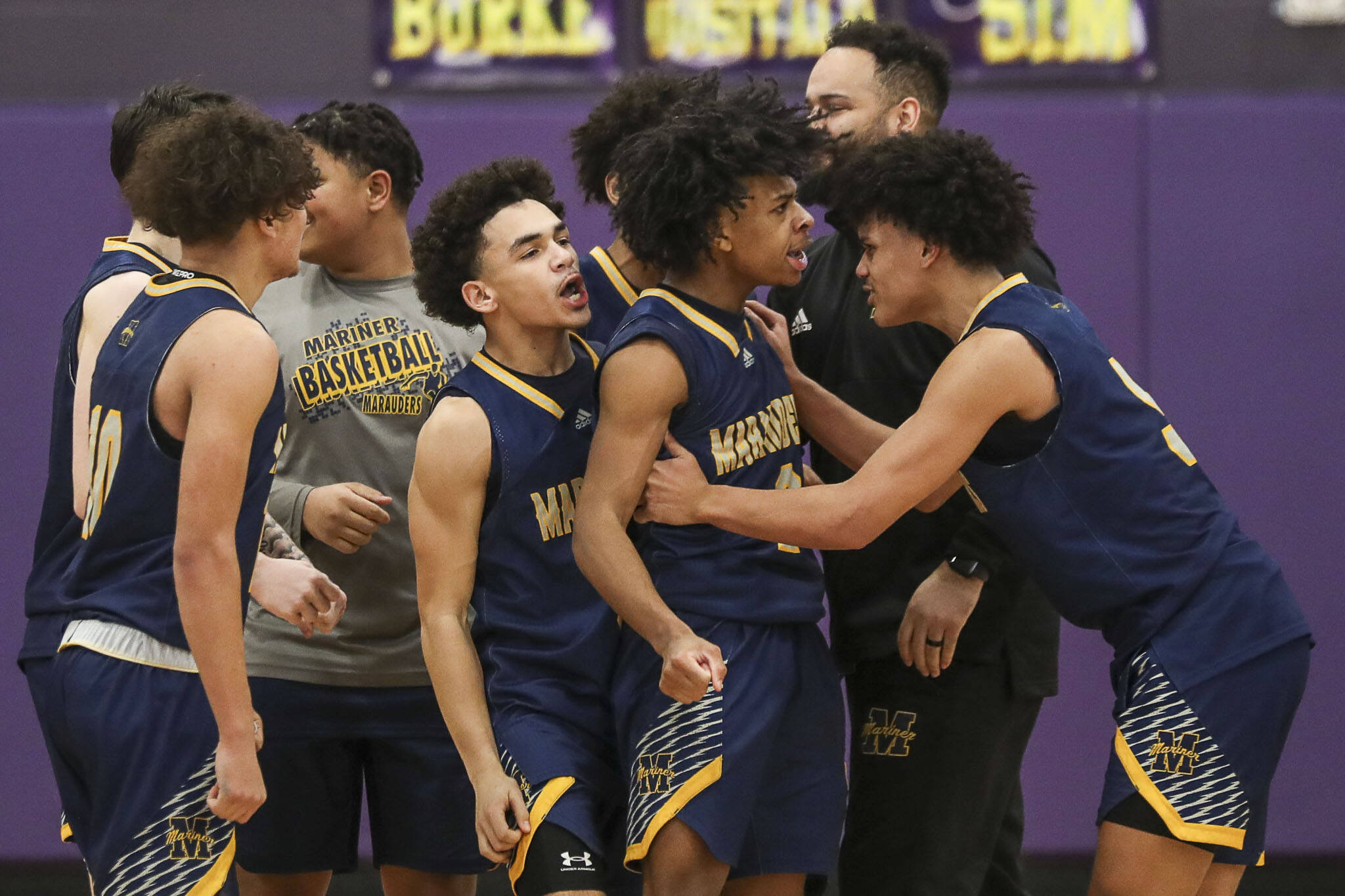 Mariner players react after winning a game between Jackson and Mariner at Lake Washington High School in Kirkland, Washington on Thursday, Feb. 16, 2023. After an intense back-and-forth in the final period Mariner defeated Jackson, 77-76. (Annie Barker / The Herald)