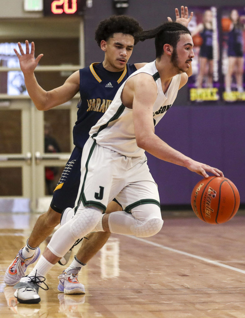 Jackson’s Trey Hawkins (3) moves with the ball during a game between Jackson and Mariner at Lake Washington High School in Kirkland, Washington on Thursday, Feb. 16, 2023. After an intense back-and-forth in the final period Mariner defeated Jackson, 77-76. (Annie Barker / The Herald)
