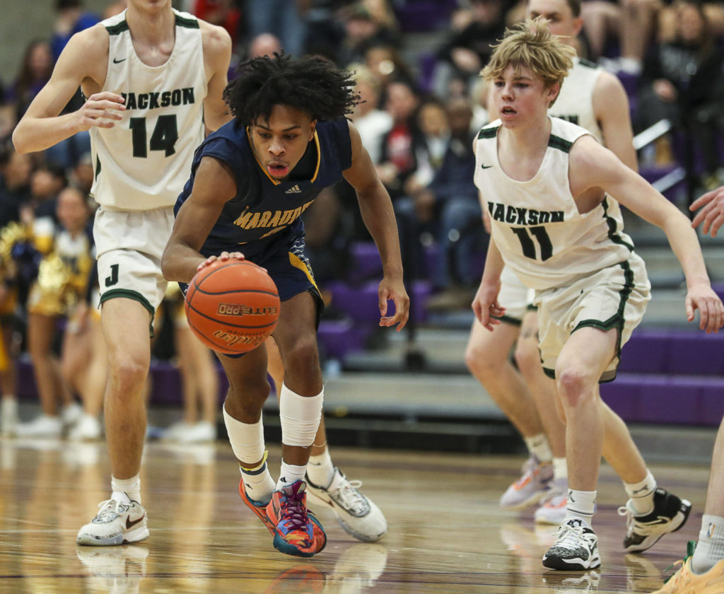 Mariner’s Jailin Johnson (2) fights for the ball during a game between Jackson and Mariner at Lake Washington High School in Kirkland, Washington on Thursday, Feb. 16, 2023. After an intense back-and-forth in the final period Mariner defeated Jackson, 77-76. (Annie Barker / The Herald)
