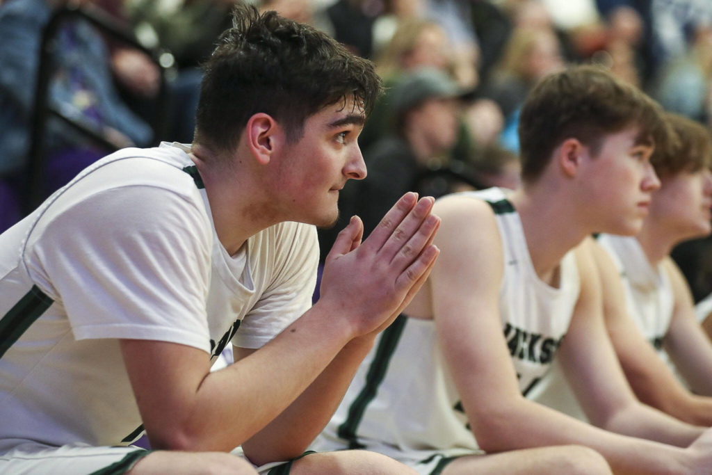 Jackson players watch during a game between Jackson and Mariner at Lake Washington High School in Kirkland, Washington on Thursday, Feb. 16, 2023. After an intense back-and-forth in the final period Mariner defeated Jackson, 77-76. (Annie Barker / The Herald)
