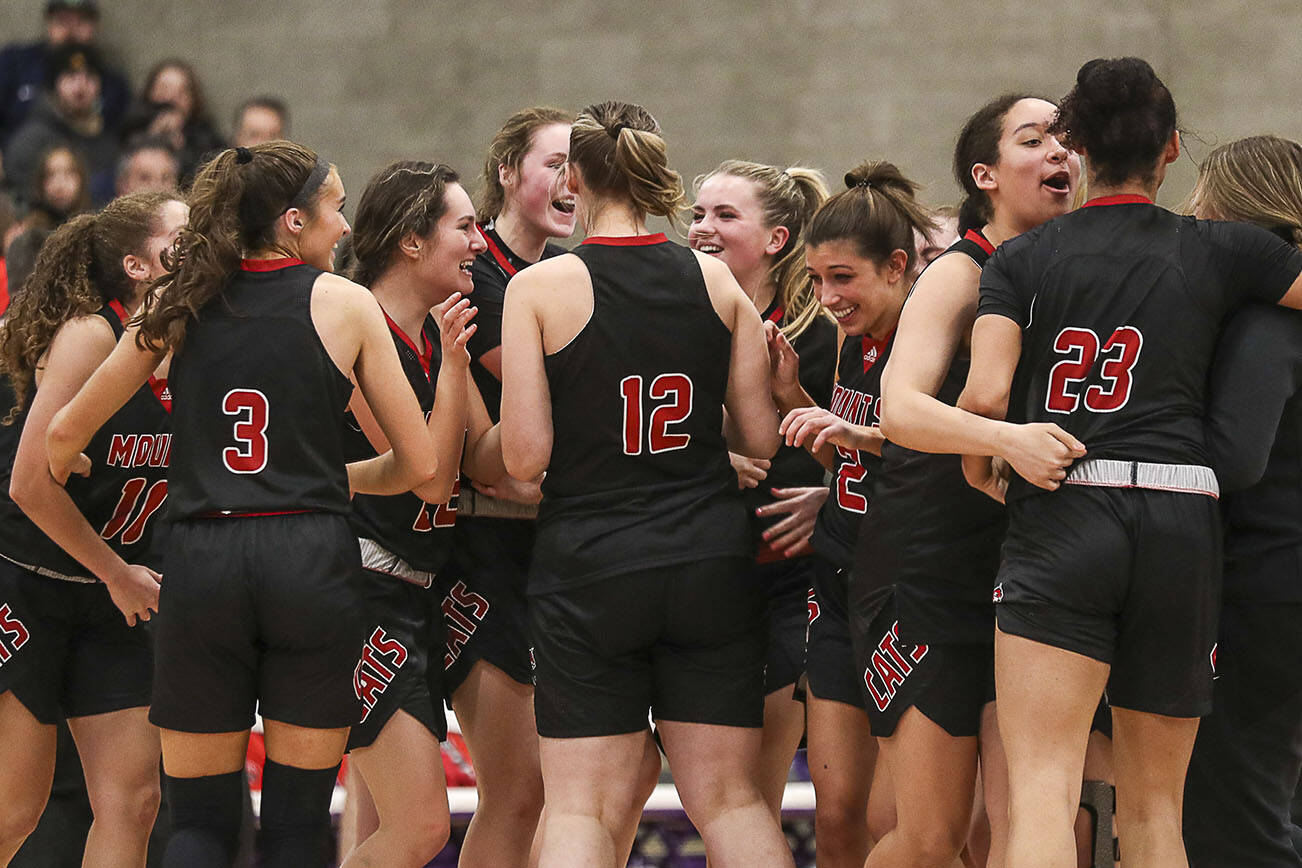 Mount Si players celebrate during a game between Lake Stevens and Mount Si at Lake Washington High School in Kirkland, Washington on Thursday, Feb. 16, 2023. Mount Si moves on in the bracket. (Annie Barker / The Herald)