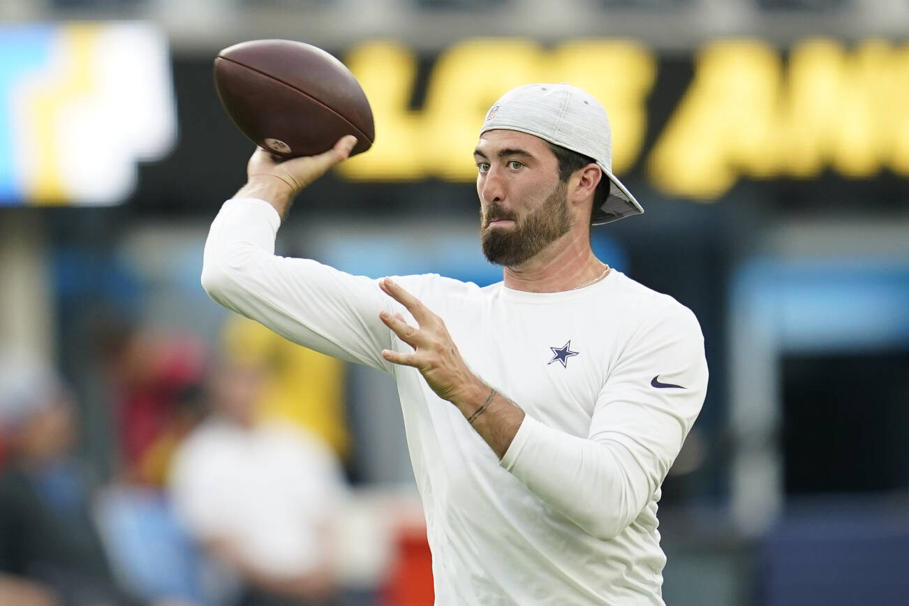 Dallas Cowboys quarterback Ben DiNucci (17) warms up before an NFL football game against the Los Angeles Chargers Wednesday, Aug. 24, 2022, in Inglewood, Calif. (AP Photo/Ashley Landis)