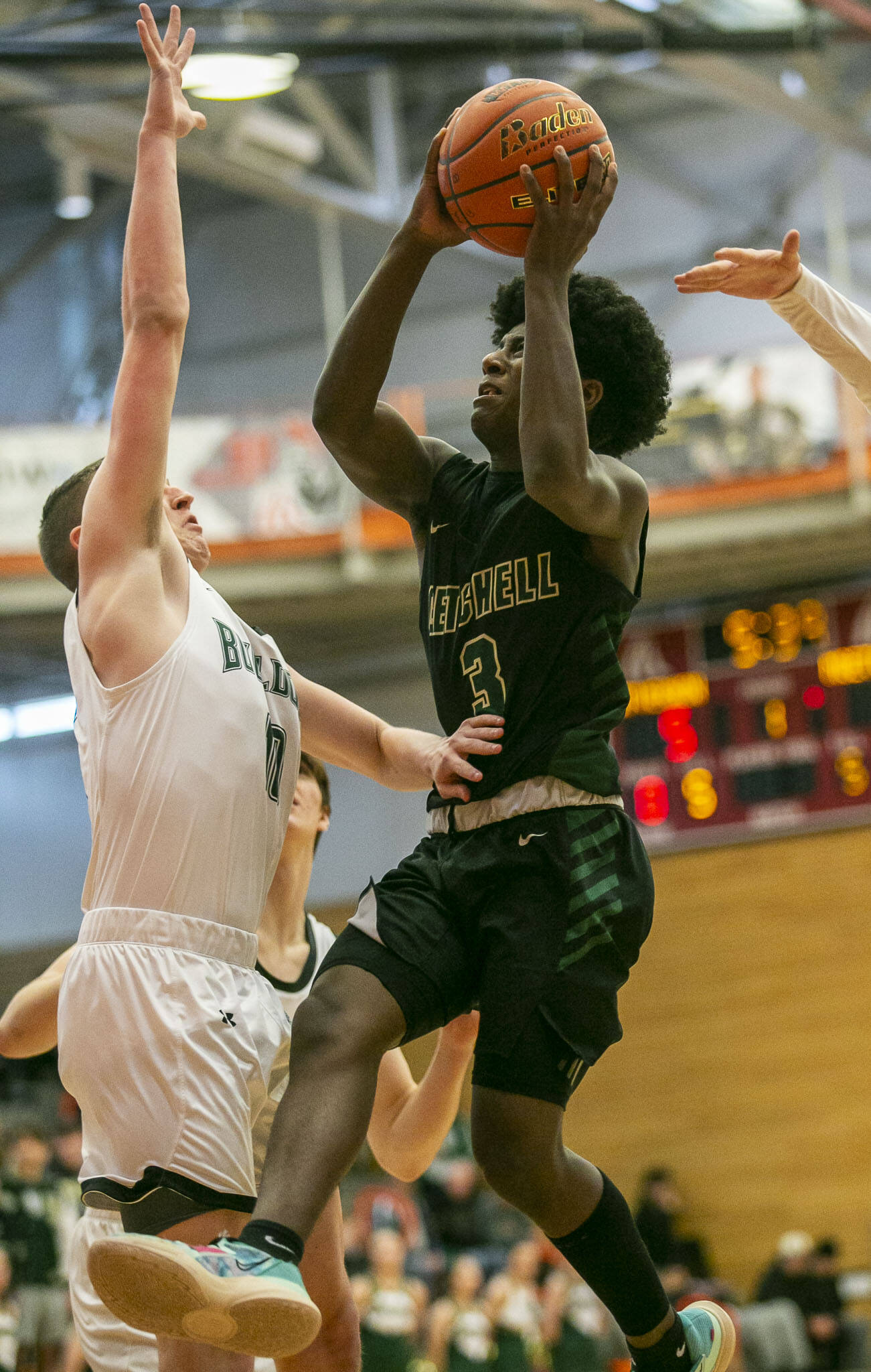 Marysville-Getchell’s Shawn Etheridge attempts a layup while being guarded during the game against Mount Vernon on Friday, Feb. 17, 2023 in Everett, Washington. (Olivia Vanni / The Herald)