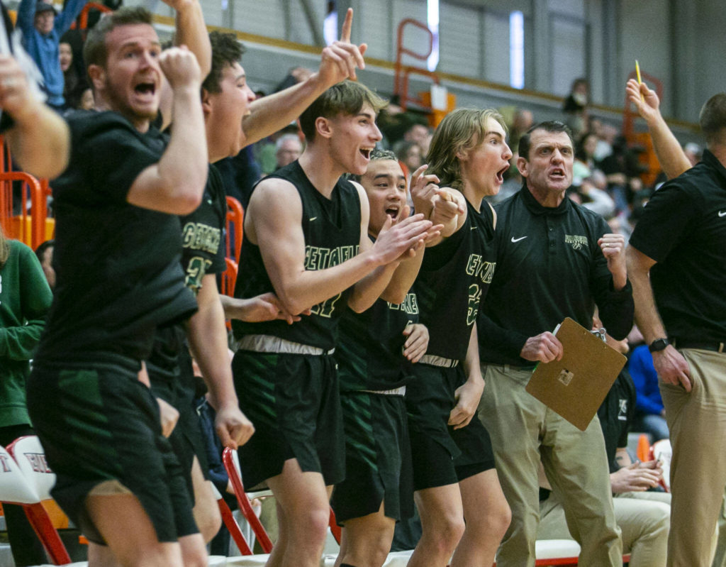 The Marysville-Getchell bench reacts to a last minute shot during the game against Mount Vernon on Friday, Feb. 17, 2023 in Everett, Washington. (Olivia Vanni / The Herald)
