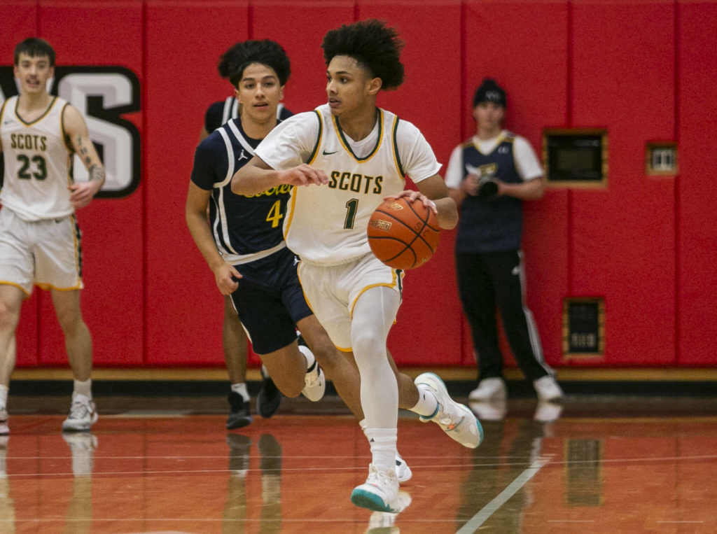 Shorecrest’s Keaine Silimon takes the ball down the court during the game against Everett on Friday, Feb. 17, 2023 in Everett, Washington. (Olivia Vanni / The Herald)
