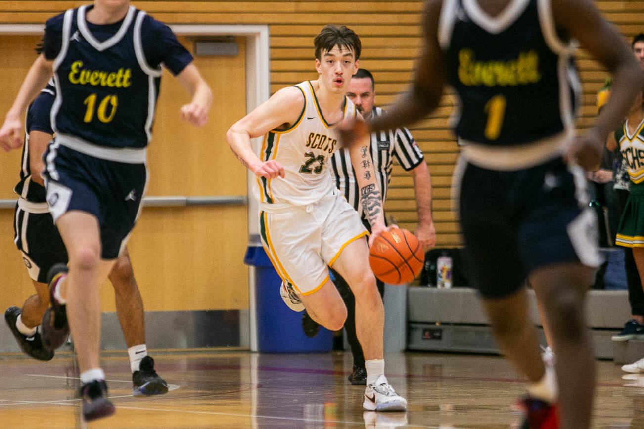 Shorecrest’s Parker Baumann takes the ball down the court during the game against Everett on Friday, Feb. 17, 2023 in Everett, Washington. (Olivia Vanni / The Herald)