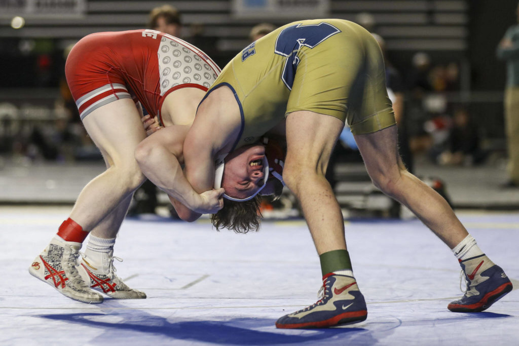 Stanwood’s Tyler Rhue and Mead’s Josh Neiwert wrestle during the 3A Boys 132-pound championship match during the Mat Classic XXXIV at the Tacoma Dome in Tacoma, Washington on Saturday, Feb. 18, 2023. (Annie Barker / The Herald)
