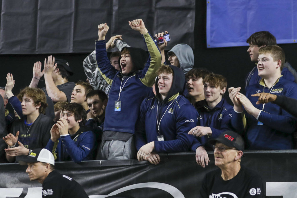 Attendees cheer during the Mat Classic XXXIV at the Tacoma Dome in Tacoma, Washington on Saturday, Feb. 18, 2023. (Annie Barker / The Herald)
