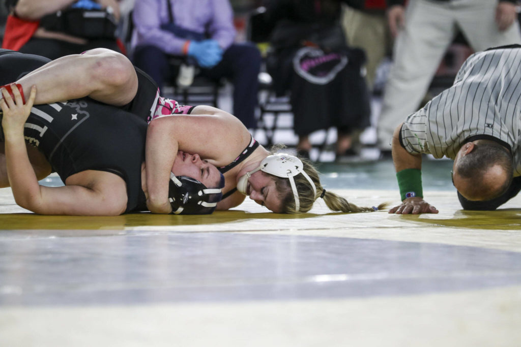 Marysville-Pilchuck’s Alivia White and Bellingham’s Isabella Phillips wrestle during the 3A/4A Girls 190-pound championship match during the Mat Classic XXXIV at the Tacoma Dome in Tacoma, Washington on Saturday, Feb. 18, 2023. (Annie Barker / The Herald)
