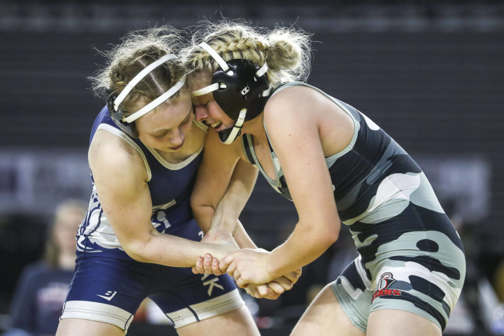 Union’s Niah Cassidy and Glacier Peak’s Karianne Baldwin wrestle during the 3A/4A Girls 125-pound championship match during the Mat Classic XXXIV at the Tacoma Dome in Tacoma, Washington on Saturday, Feb. 18, 2023. (Annie Barker / The Herald)
