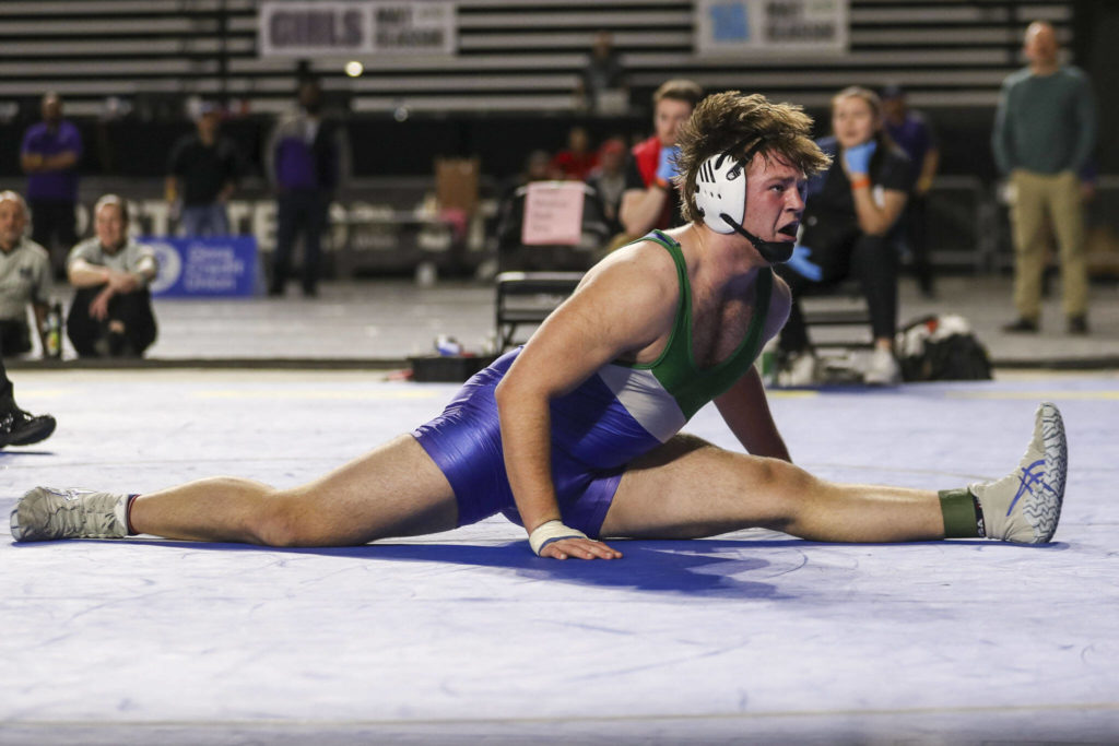 Shorewood’s Hunter Tibodeau celebrates winning the 3A Boys 220-pound championship match during the Mat Classic XXXIV at the Tacoma Dome in Tacoma, Washington on Saturday, Feb. 18, 2023. (Annie Barker / The Herald)
