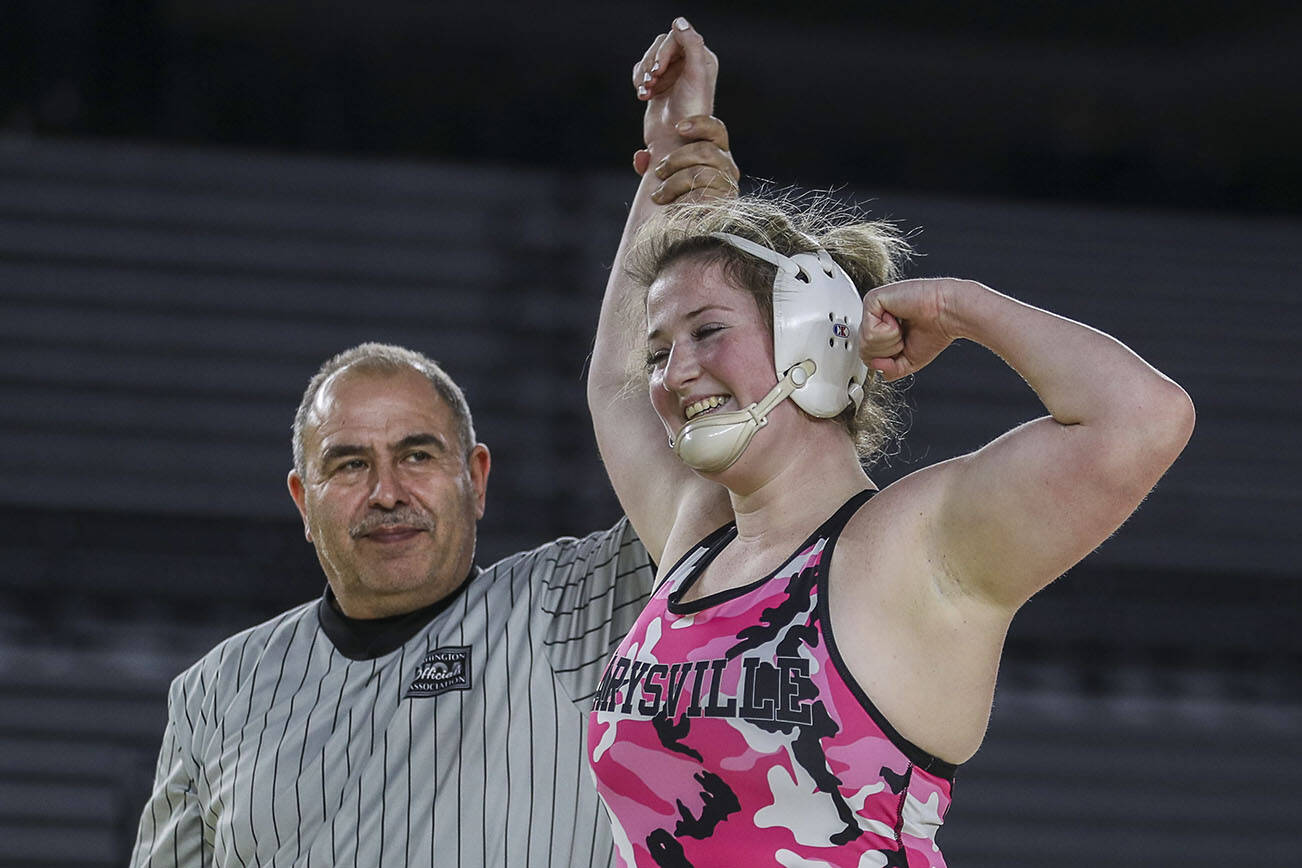 Marysville-Pilchuck’s Alivia White celebrates winning the 3A/4A Girls 190-pound championship match during the Mat Classic XXXIV at the Tacoma Dome in Tacoma, Washington on Saturday, Feb. 18, 2023.  (Annie Barker / The Herald)