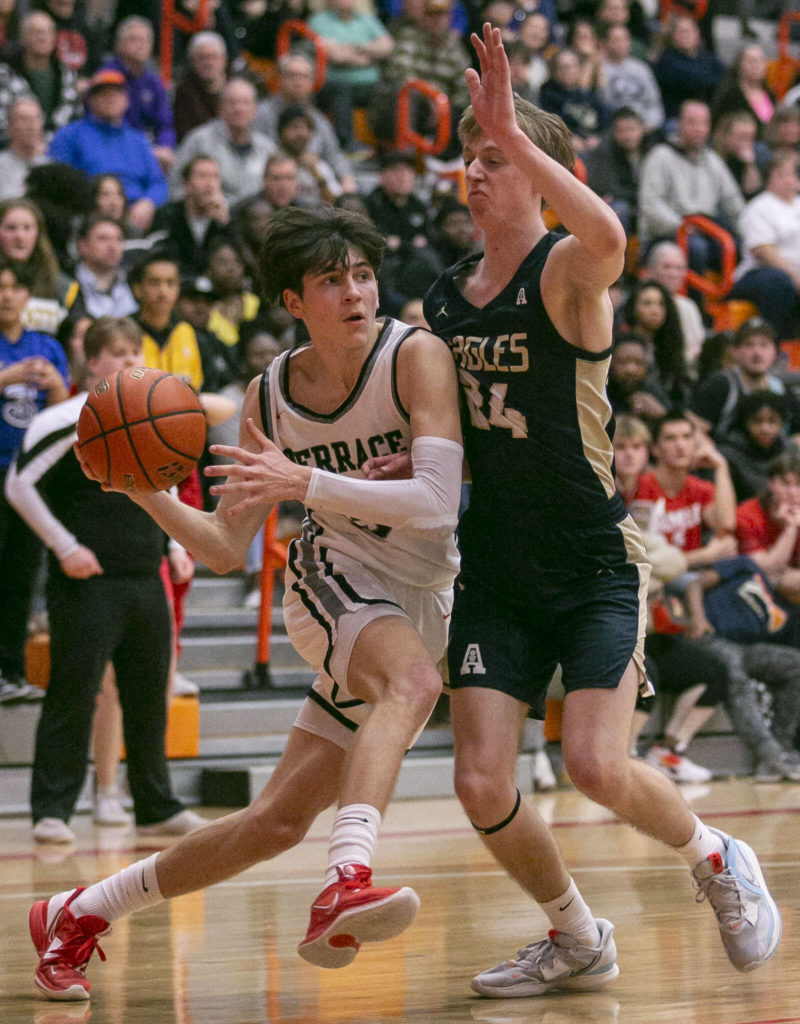 Mountlake Terrace’s Jaxon Dubiel drives to the hoop during the game against Arlington on Saturday, Feb. 18, 2023 in Everett, Washington. (Olivia Vanni / The Herald)
