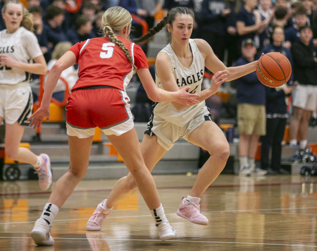 Arlington’s Jenna Villa runs a play during the game against Stanwood on Saturday, Feb. 18, 2023 in Everett, Washington. (Olivia Vanni / The Herald)
