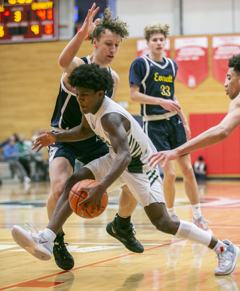 Marysville Getchell’s Shawn Etheridge is fouled while driving to the hoop during the game against Everett on Saturday, Feb. 18, 2023 in Everett, Washington. (Olivia Vanni / The Herald)
