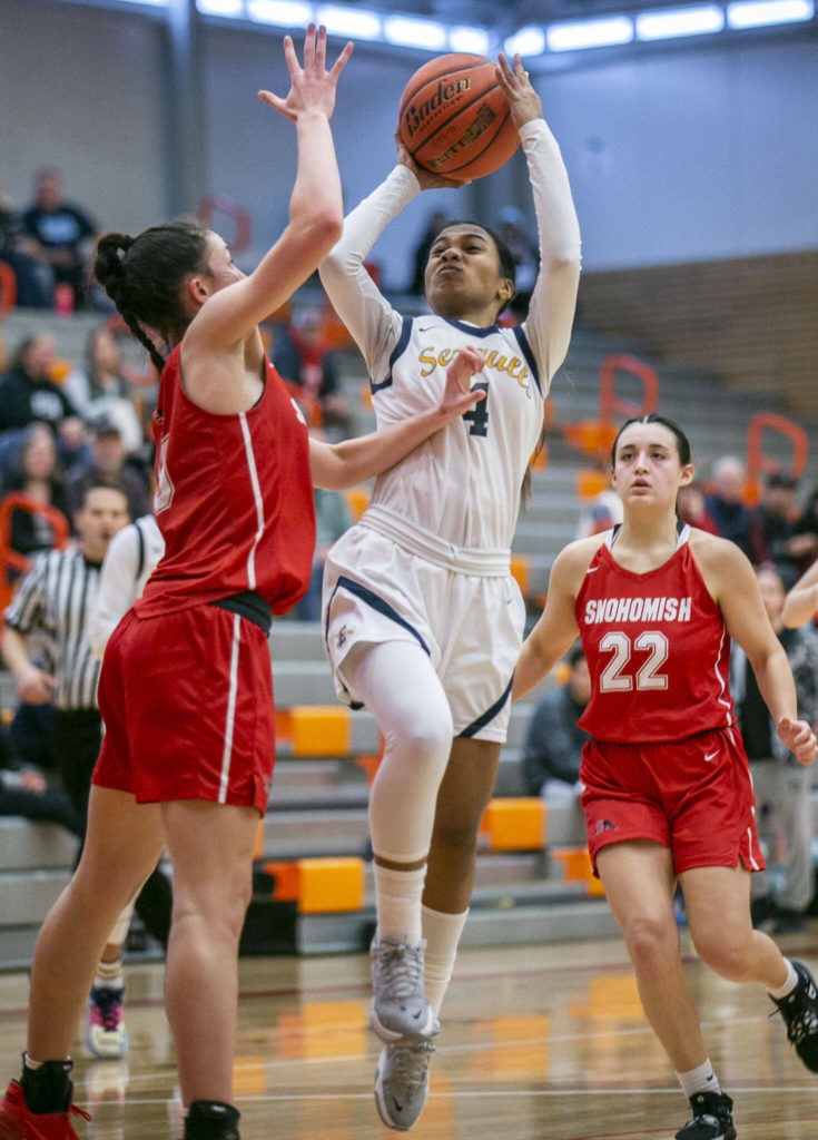 Everett’s Mylie Wugumgeg is pushed while attempting a lay up during the game against Snohomish on Saturday, Feb. 18, 2023 in Everett, Washington. (Olivia Vanni / The Herald)
