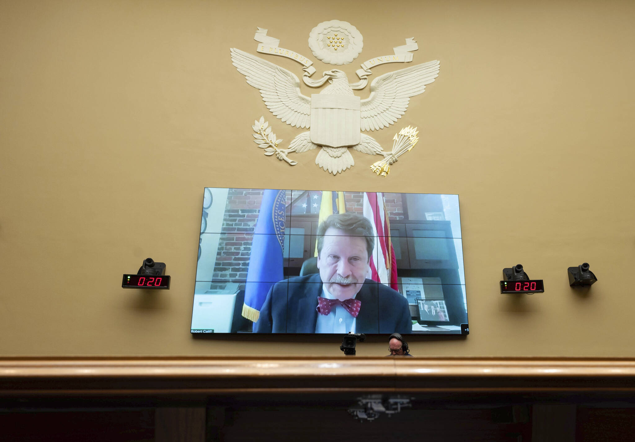 FILE - Food and Drug Administration Commissioner Robert Califf testifies via video during a House Commerce Oversight and Investigations subcommittee hybrid hearing on the nationwide baby formula shortage on Wednesday, May 25, 2022, in Washington. Califf has spent much of his last year on the job warning that growing “distortions and half-truths” surrounding vaccines and other medical products are a major driver of sickness and death in America. (AP Photo/Kevin Wolf, File)