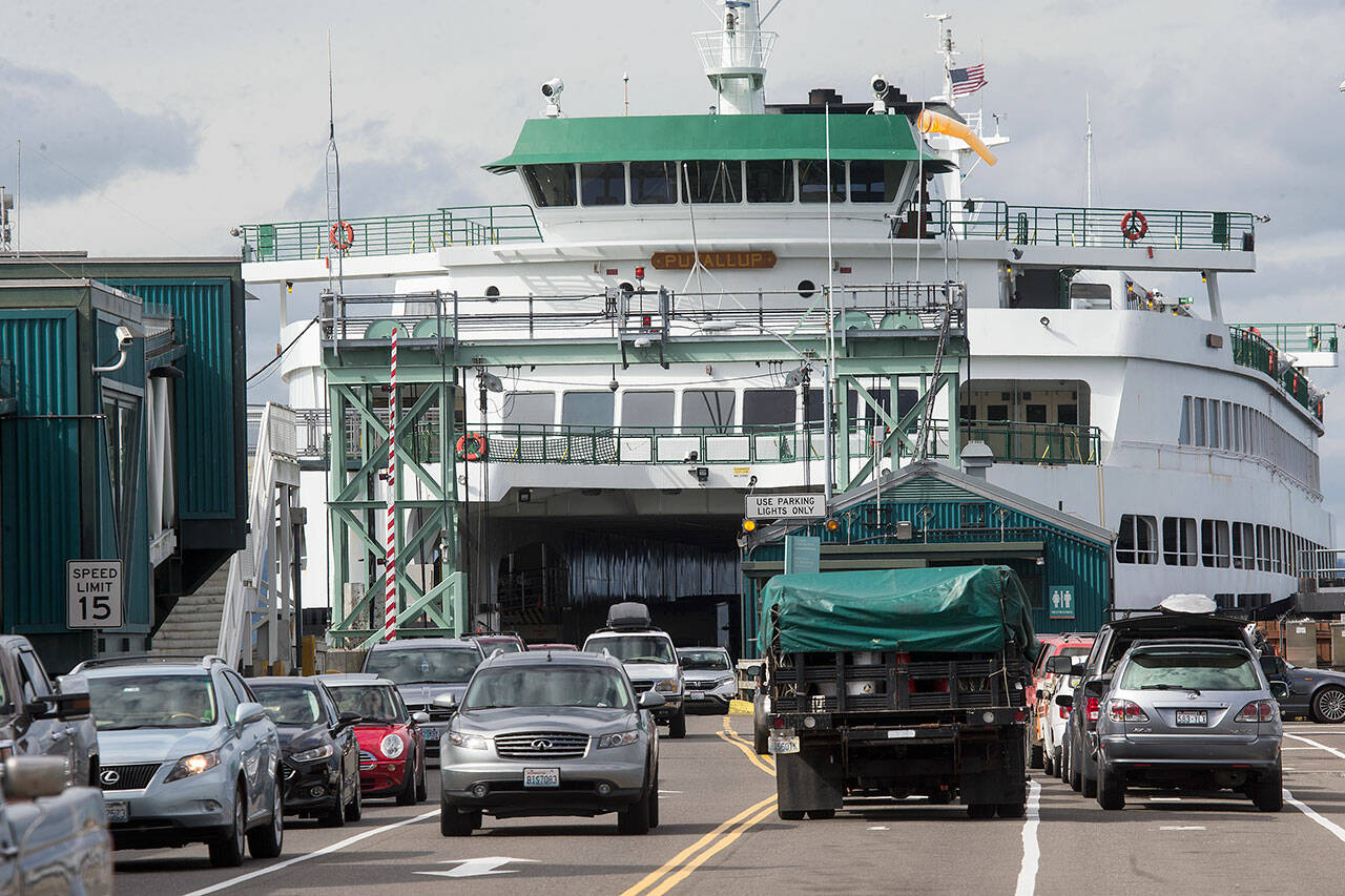 The MV Puyallup, a ferry capable of carrying 202 cars, offloads at the Edmonds Ferry dock on Sept. 21, 2018 in Edmonds. (Andy Bronson / The Herald)