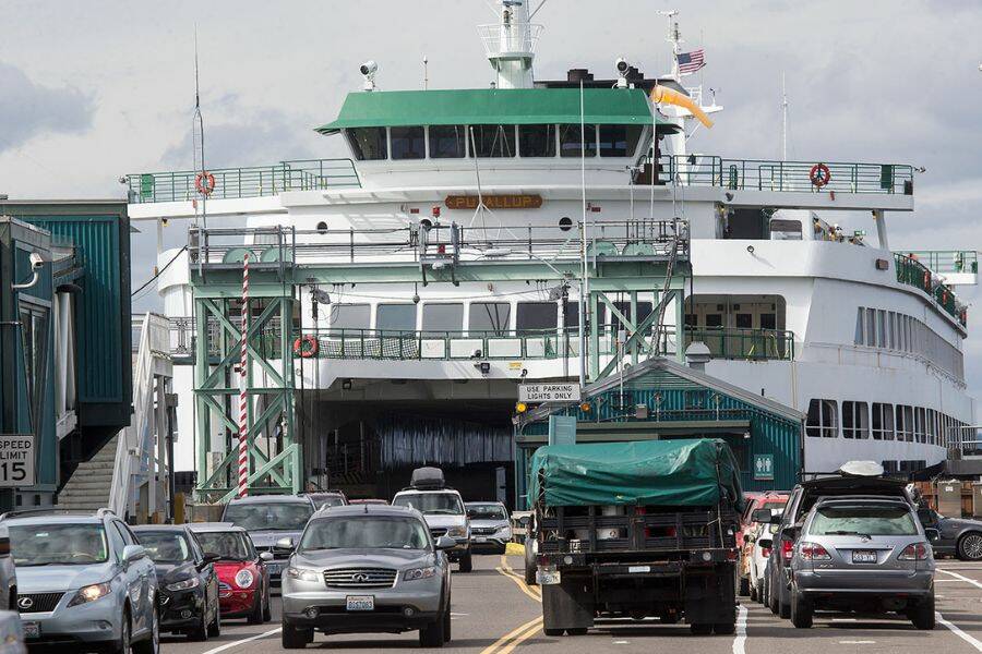 The MV Puyallup, a ferry capable of carrying 202 cars, offloads at the Edmonds Ferry dock on Friday, Sept. 21, 2018 in Edmonds, Wa. (Andy Bronson / The Herald)