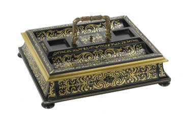 This brass inlaid inkstand was made in Victorian London. A label on its base provides insight into its history.