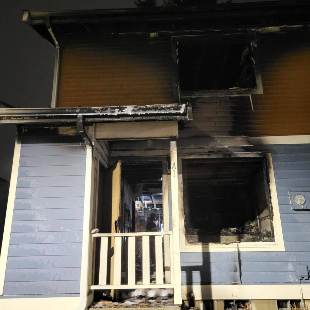 The Everett Fire Department responded to a fire coming from one of the units in a four-plex apartment building in the 9800 block of 3rd Avenue SE around 11:30 p.m. on Dec. 25, 2022, in Everett. (Everett Fire Department) 
