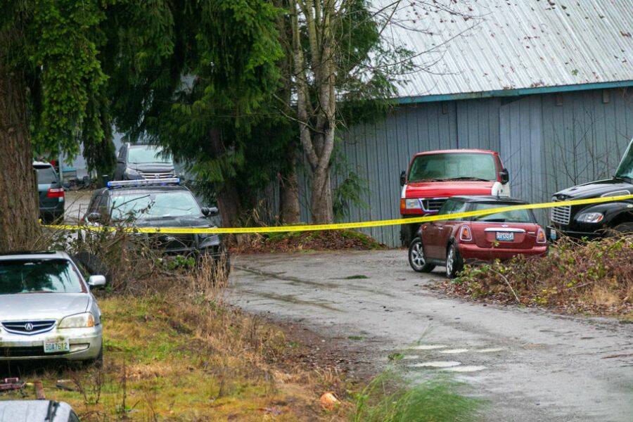 Police tape blocks off an area between two businesses in a residential area along 20th Street SE near Route 9 after a police-involved shooting that left one person dead Friday, Jan. 13, 2023, in Lake Stevens, Washington. (Ryan Berry / The Herald)