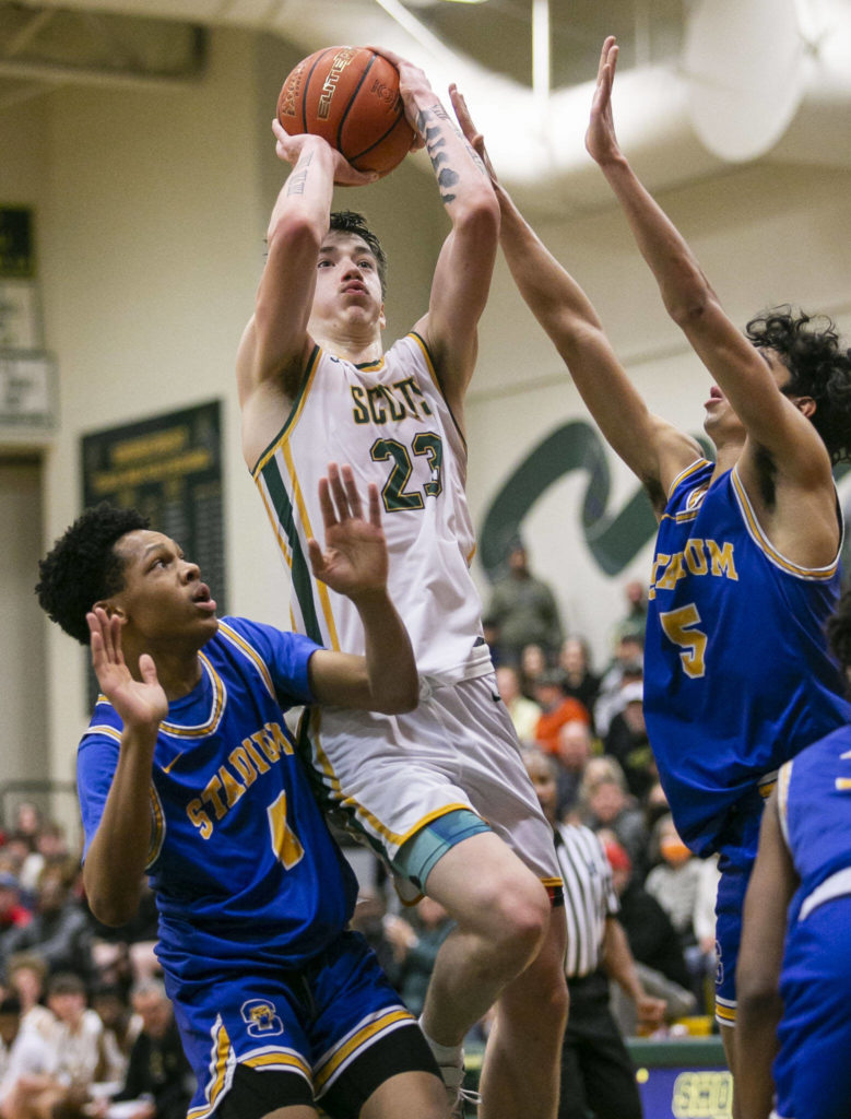 Shorecrest’s Parker Baumann attempts a jumpshot while being guarded during the game against Stadium on Tuesday, Feb. 21, 2023 in Shoreline, Washington. (Olivia Vanni / The Herald)
