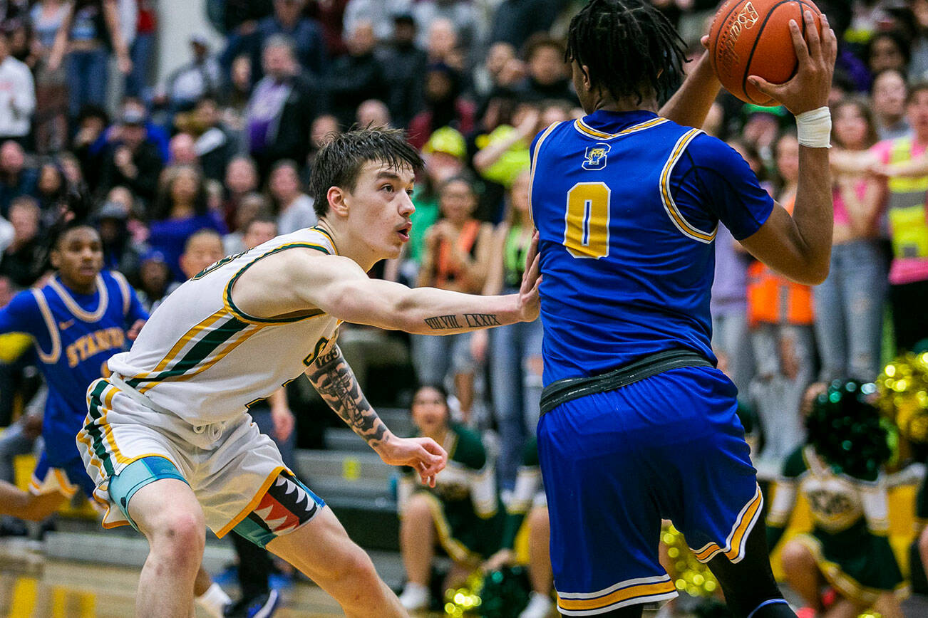 Shorecrest’s Parker Baumann reaches out to to try and block a pass by Stadium’s Ne’Quan Brown during the game against Stadium on Tuesday, Feb. 21, 2023 in Shoreline, Washington. (Olivia Vanni / The Herald)