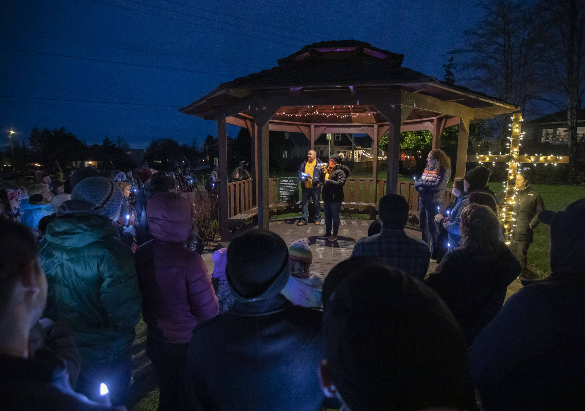 Nurses and community members gather Saturday as nurse Valerie Whorton speaks about the need for safer staffing standards in light of increasing patient loads at Providence Regional Medical Center Everett during a vigil at Drew Nielsen Neighborhood Park in Everett. (Olivia Vanni / The Herald)