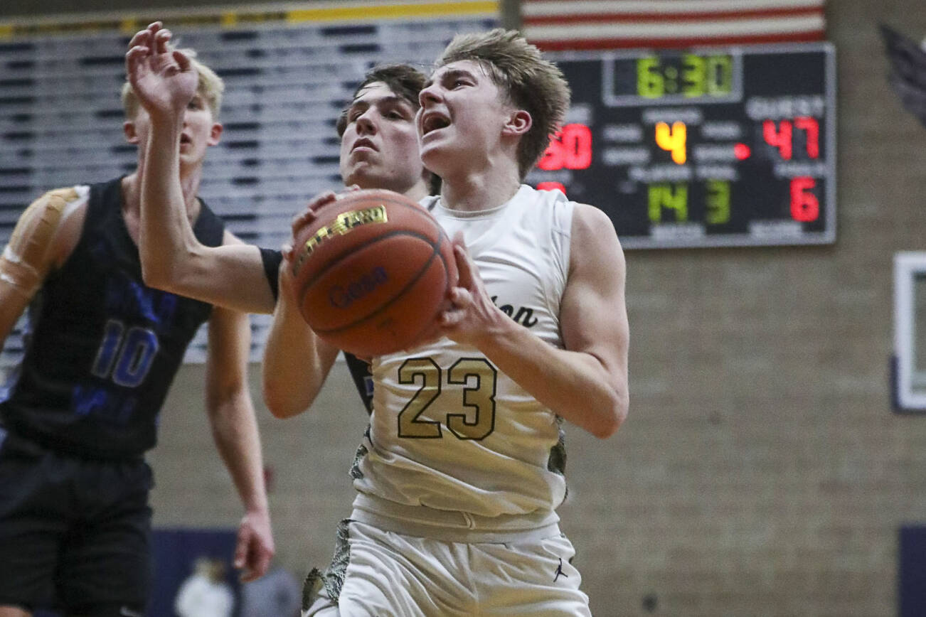 Arlington’s Leyton Martin (23) shoots the ball during a game between the Arlington Eagles and Walla Walla Blue Devils at Arlington High School in Arlington, Washington on Saturday, Feb. 25, 2023. Arlington won, 68-57. (Annie Barker / The Herald)