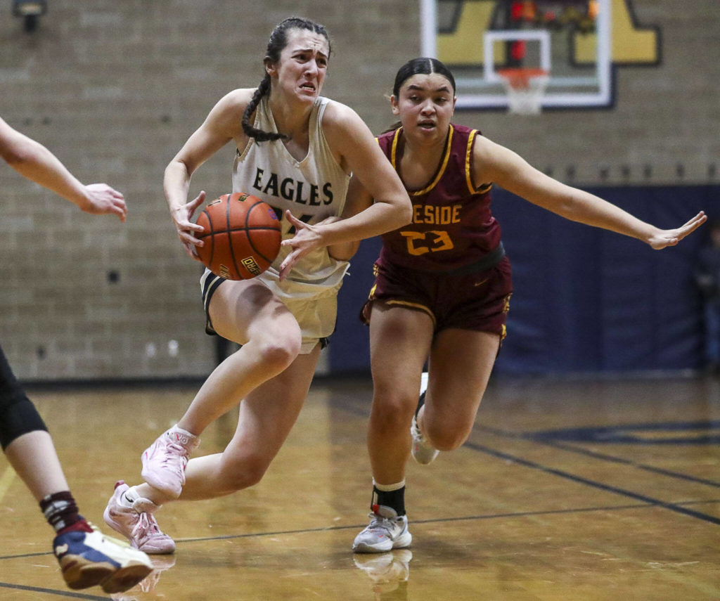 Arlington’s Jenna Villa (34) moves with the ball during a state playoff game against Lakeside at Arlington High School on Saturday. Arlington won 75-63. (Annie Barker / The Herald)
