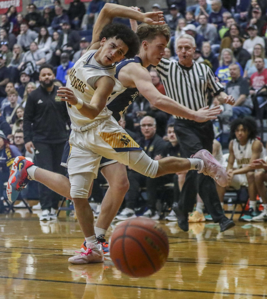 Mariner’s Macky James (3) loses the ball during a state playoff game against Chiawana at Arlington High School on Saturday. Mariner won 85-74. (Annie Barker / The Herald)

