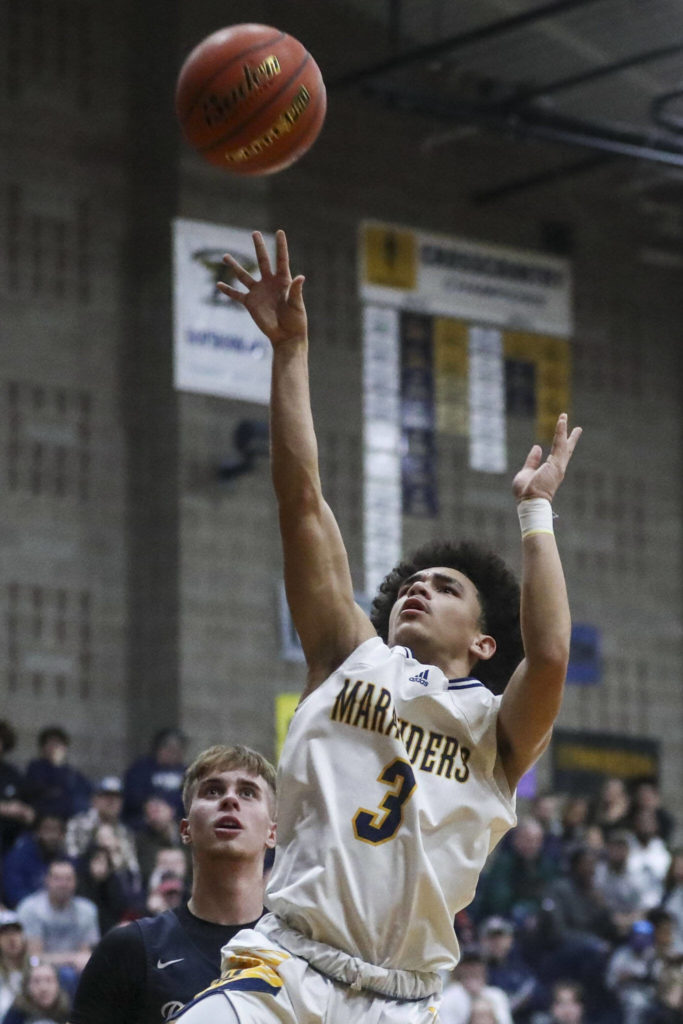 Mariner’s Macky James (3) shoots the ball during a state playoff game against Chiawana at Arlington High School on Saturday. Mariner won 85-74. (Annie Barker / The Herald)
