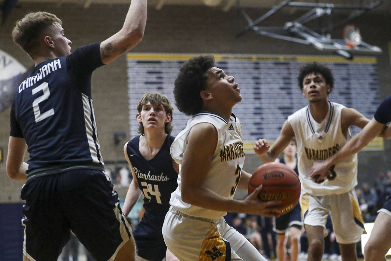 Mariner’s Macky James (3) shoots the ball during a game between the Mariner Marauders and the Chiawana Riverhawks at Arlington High School in Arlington, Washington on Saturday, Feb. 25, 2023. The Mariners won, 85-74. (Annie Barker / The Herald)