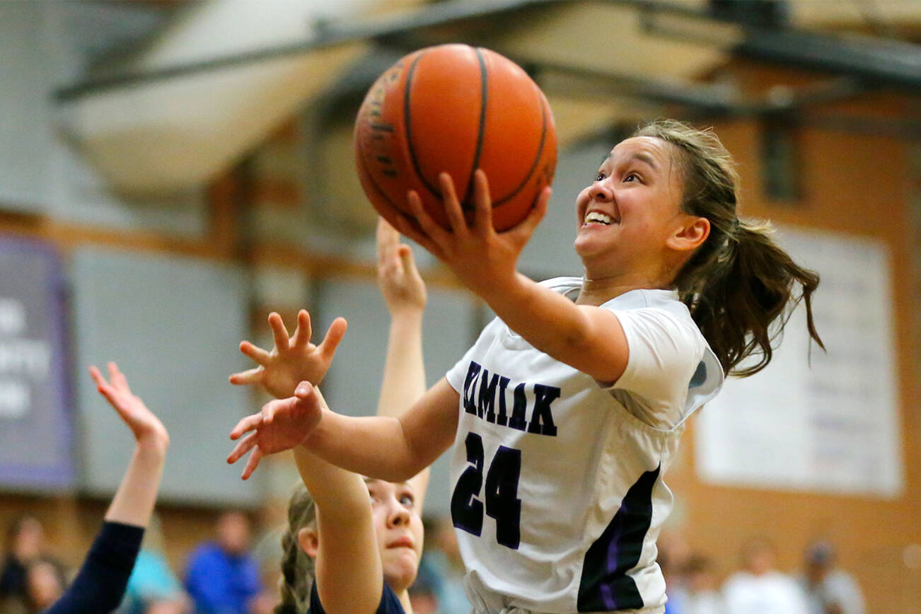 Kamiak’s Bella Hasad hits an acrobatic layup in the final moments of a game against Glacier Peak on Wednesday, Feb 1, 2023, at Kamiak High School in Mukilteo, Washington. (Ryan Berry / The Herald)