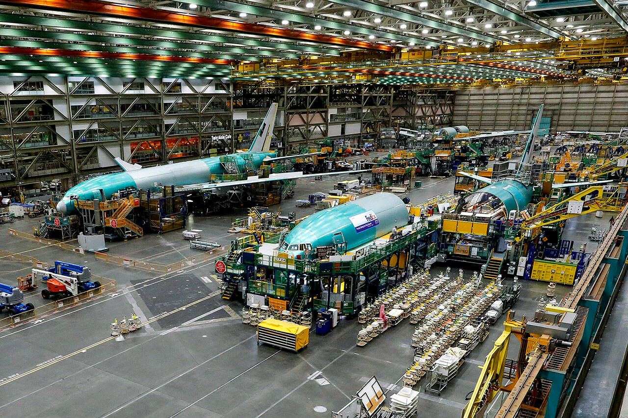 Boeing 777 freighters are seen in various stages of assembly at the company’s Everett Production Facility, on June 15, in Everett. (Jennifer Buchanan/The Seattle Times/TNS)