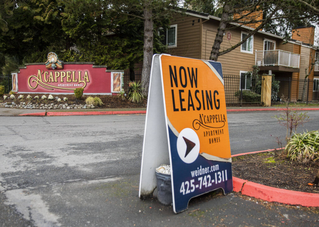 A leasing sign is visible outside of A’cappella Apartment Homes on March 1 in Everett, Washington. (Olivia Vanni / The Herald)
