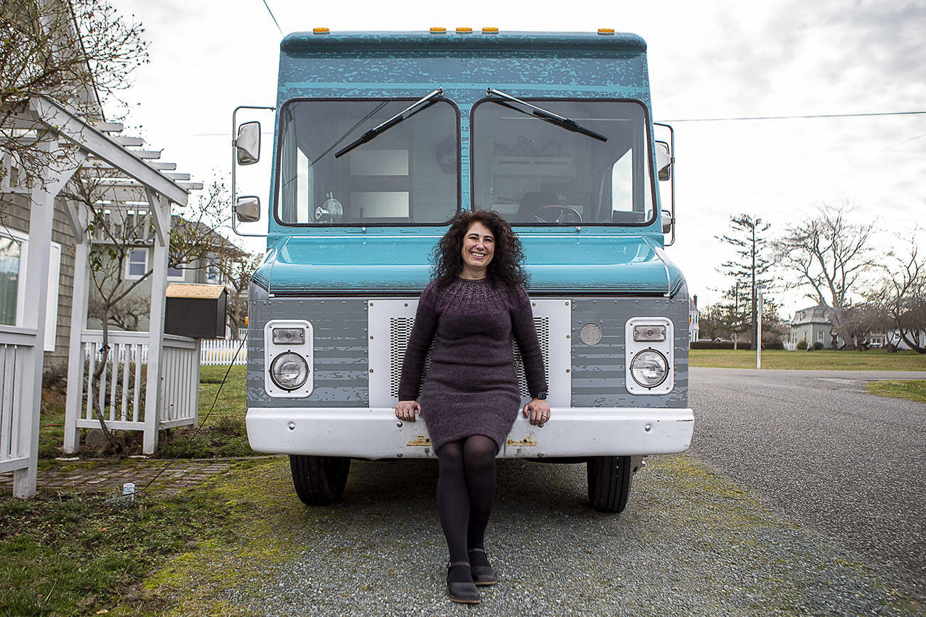 Willow Mietus, 50, poses for a photo at her home in Coupeville, Washington on Wednesday, Feb. 1, 2023. Mietus bought a former Frito-Lay truck to sell her dyed yarn out of. She calls it "The Wool Wagon." (Annie Barker / The Herald)