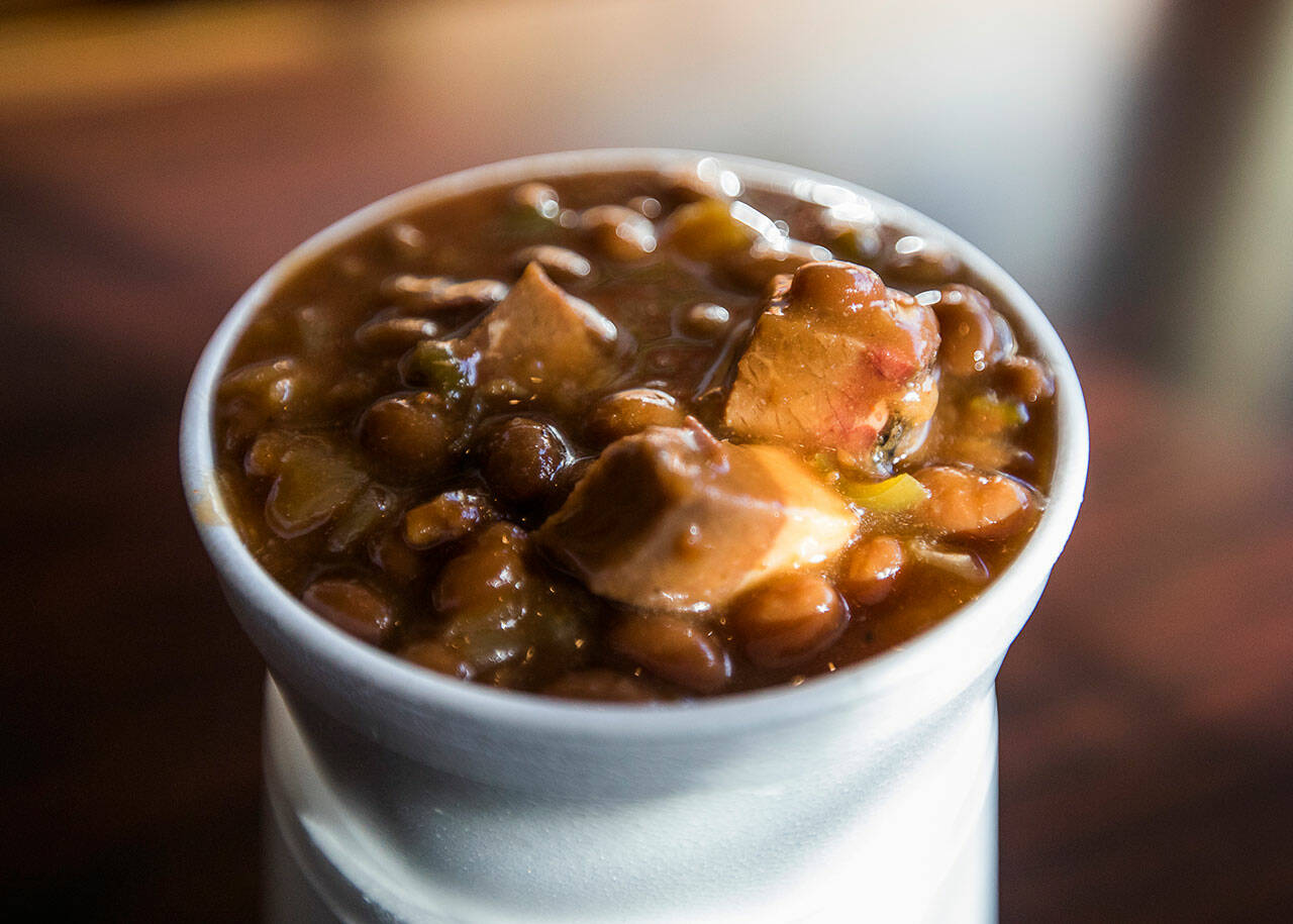 A cup of fresh brisket baked beans from Jeff’s Texas Style BBQ in Marysville. (Olivia Vanni / The Herald)