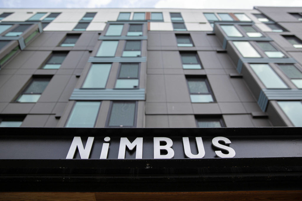 The Nimbus Apartments tower nine stories into the sky in downtown Everett. (Ryan Berry / The Herald)
