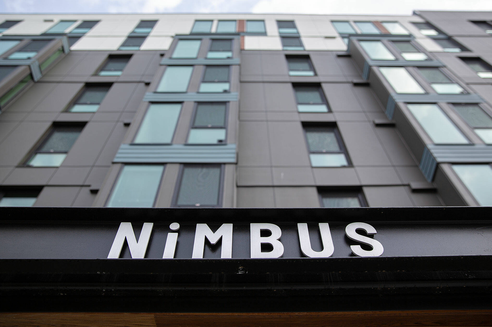The Nimbus Apartments tower nine stories into the sky in downtown Everett. (Ryan Berry / The Herald)