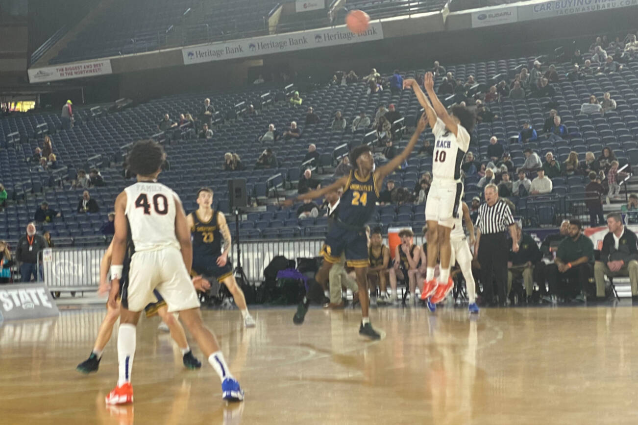 Shorecrest's Adarrius Hilliard (24) defends a shot by Rainier Beach's Darius Wilcher (10) during a 3A state playoff game on Wednesday, March 1, 2023, at the Tacoma Dome. (Nick Patterson / The Herald)