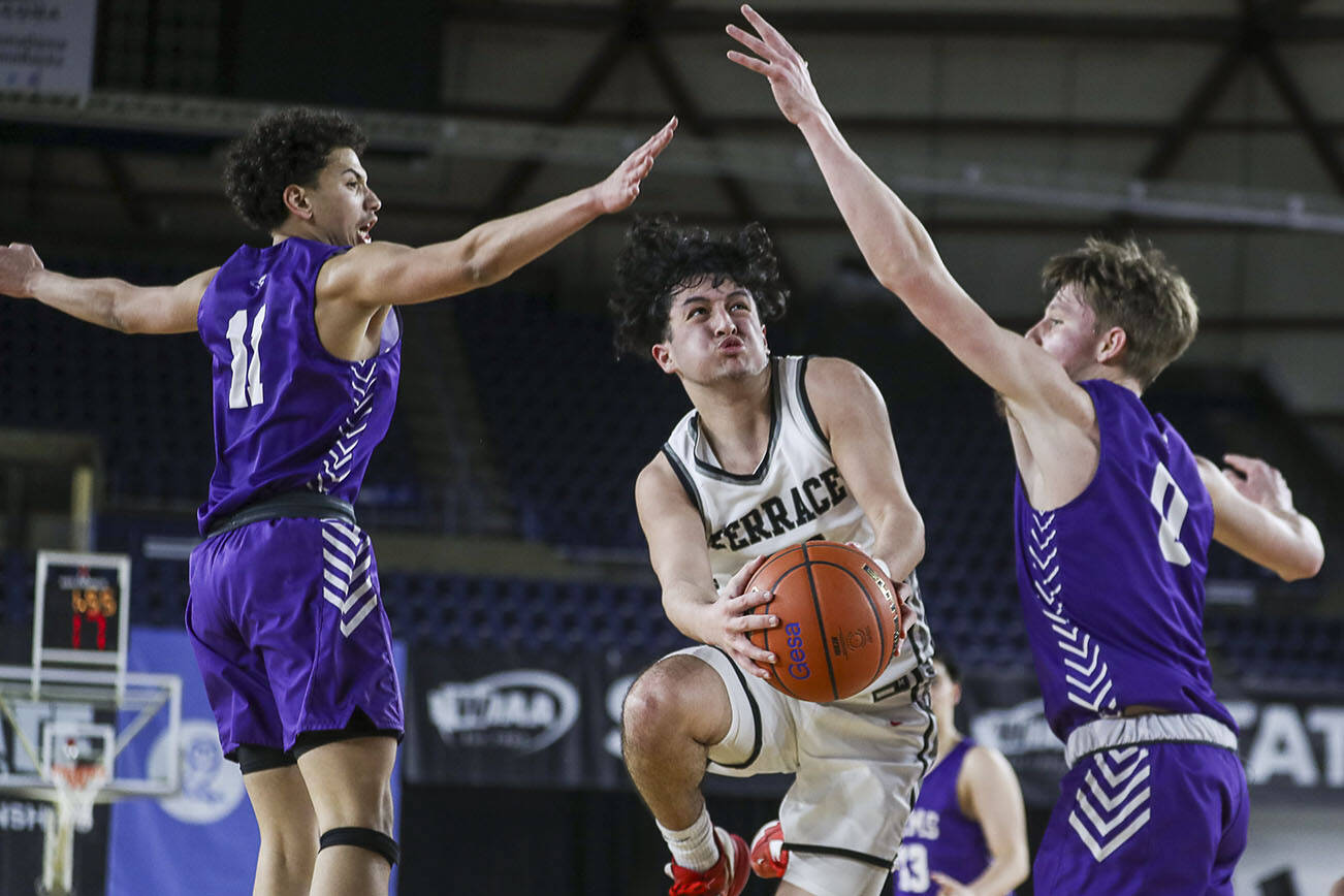 Mountlake Terrace’s Logan Tews (21) moves with the ball during a 3A boys game in the Hardwood Classic between Mountlake Terrace and North Thurston at the Tacoma Dome in Tacoma, Washington on Wednesday, March 1, 2023. Mountlake Terrace won, 58-53. (Annie Barker / The Herald)