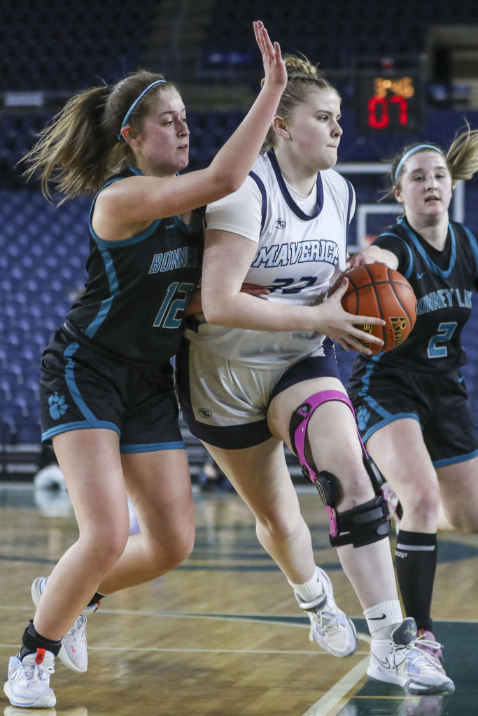 Meadowdale’s Mackenzie Tindall (33) moves with the ball during a 3A girls game in the Hardwood Classic between Meadowdale and Bonney Lake at the Tacoma Dome in Tacoma, Washington on Wednesday, March 1, 2023. Meadowdale won, 62-35.(Annie Barker / The Herald)
