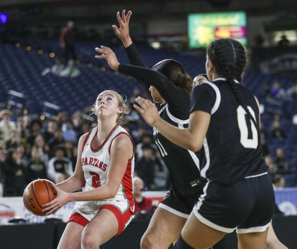 Stanwood’s Ellalee Wortham (2) shoots the ball during a 3A girls game in the Hardwood Classic between Lynnwood and Stanwood at the Tacoma Dome in Tacoma, Washington on Wednesday, March 1, 2023. Stanwood won, 74-69. (Annie Barker / The Herald)
